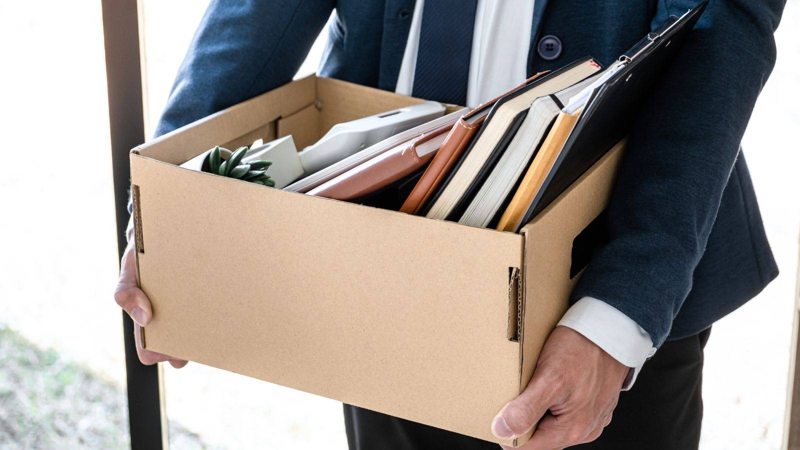 Employee carrying a box after unfair dismissal – unfair dismissal claim London