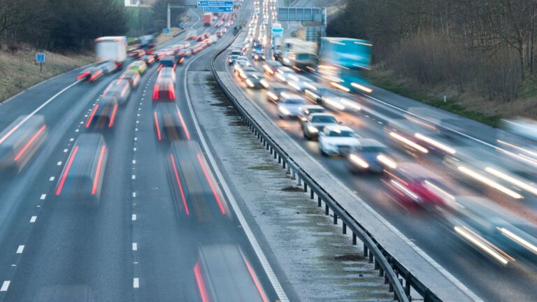 UK motorway traffic with motion blur representing ILR refused driving offence UK 2025 immigration consequences and legal analysis