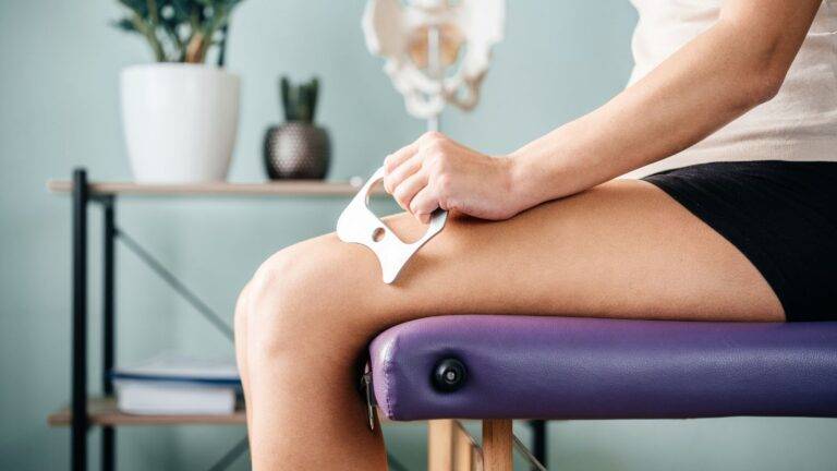 Person applying cold therapy ice pack to knee injury demonstrating soft tissue injury claims UK 2026 treatment and recovery process for compensation assessment