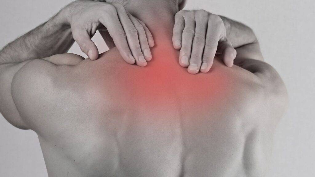 Back pain injury illustration showing whiplash payout scale uk 2025 compensation assessment areas